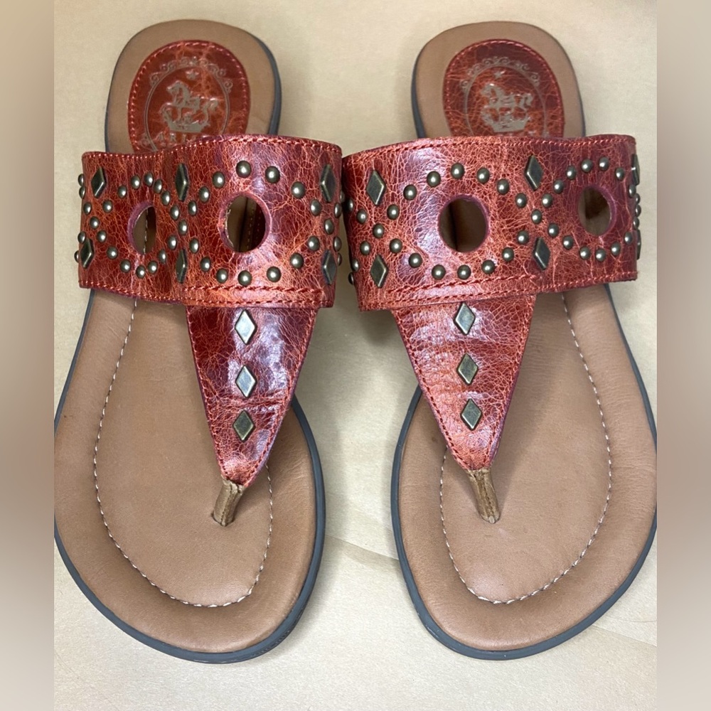 Ariat Copper-brown studded thong style sandal with cut out details.Size …